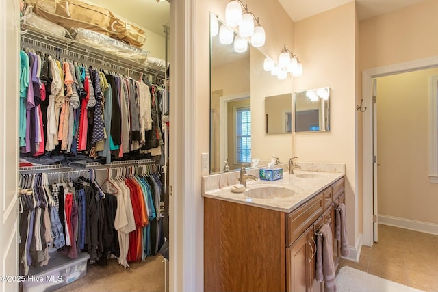 bathroom featuring tile patterned floors and vanity