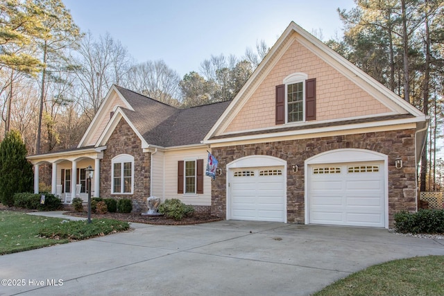 view of front of property with a garage and covered porch