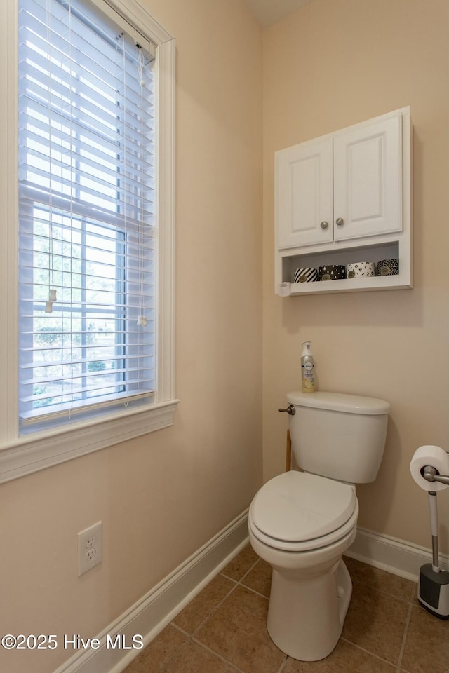 bathroom featuring tile patterned floors and toilet