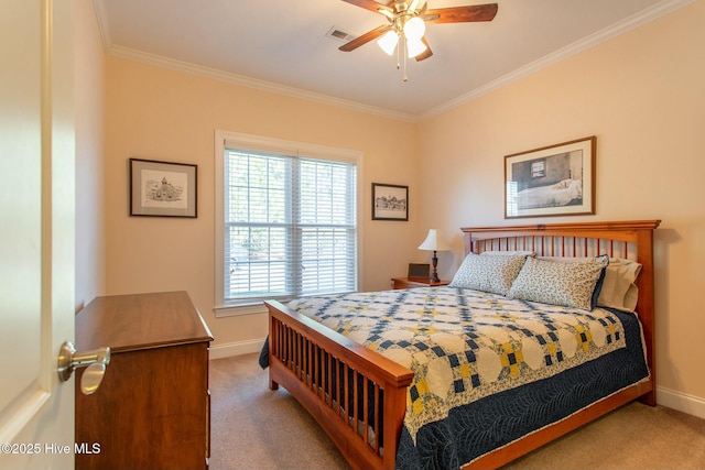 carpeted bedroom featuring crown molding and ceiling fan