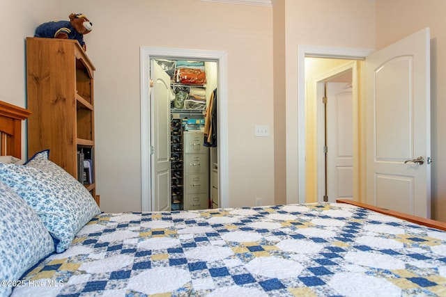 bedroom with a spacious closet and a closet