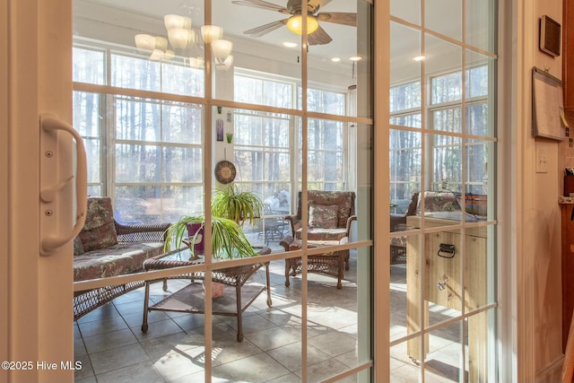 sunroom / solarium with ceiling fan