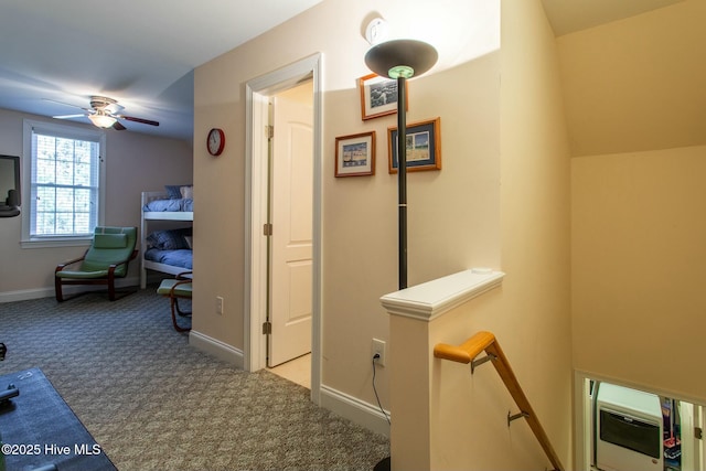 corridor featuring lofted ceiling and light carpet