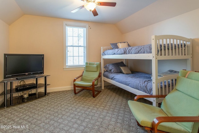 carpeted bedroom with vaulted ceiling and ceiling fan