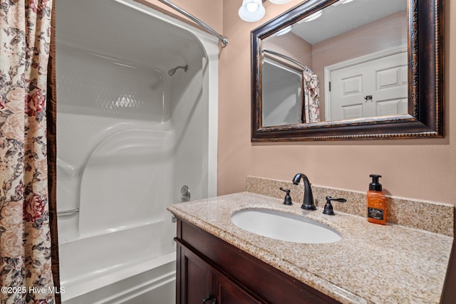 full bathroom with shower / bathtub combination with curtain and vanity