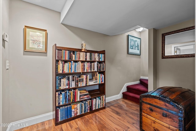 sitting room with wood finished floors and baseboards