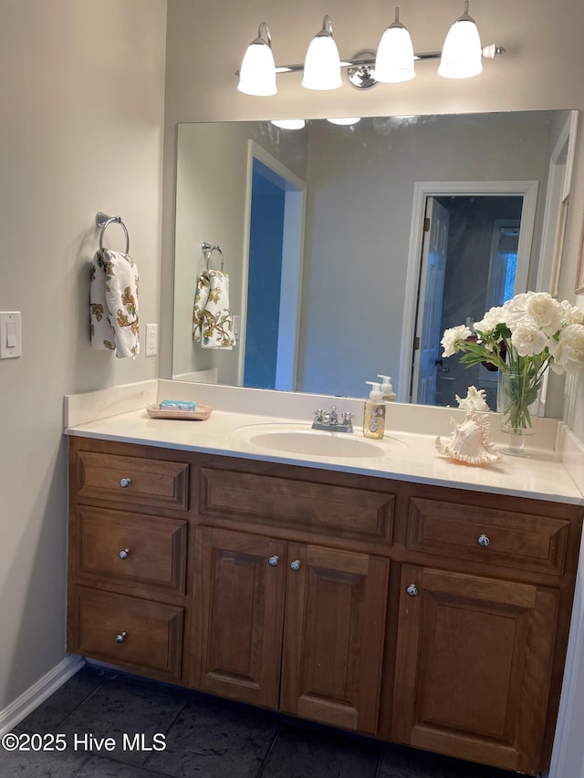 bathroom featuring tile patterned flooring and vanity