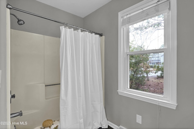 bathroom featuring shower / bath combination with curtain