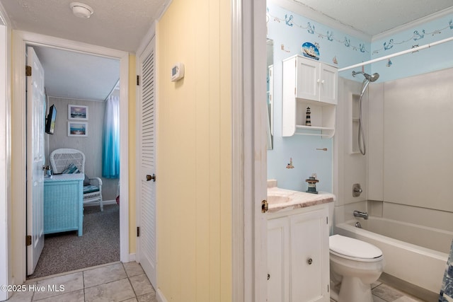 full bathroom featuring tile patterned flooring, vanity, a textured ceiling, bathtub / shower combination, and toilet