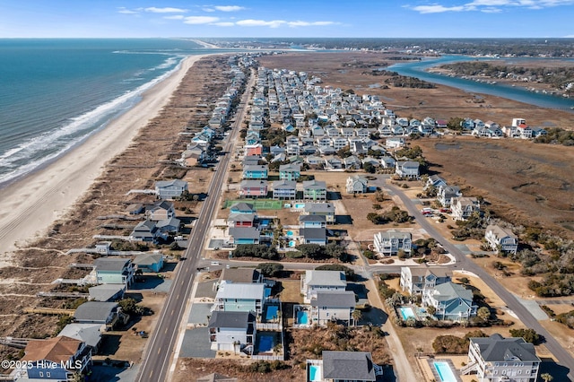 aerial view with a beach view and a water view