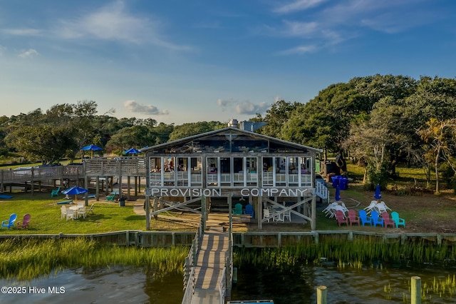 back of house with a water view