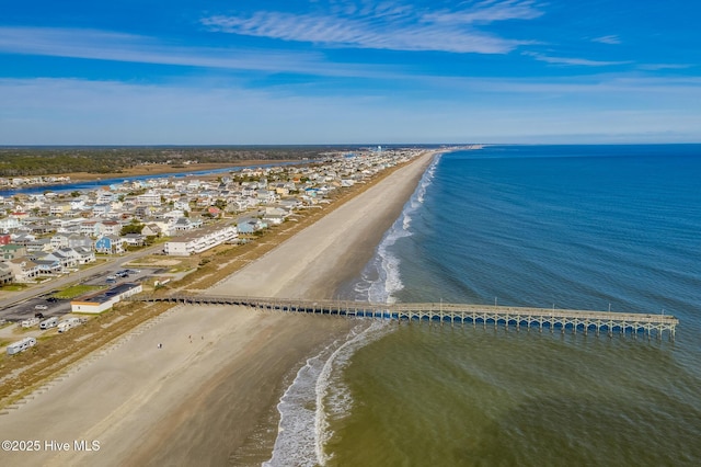 birds eye view of property featuring a water view and a beach view