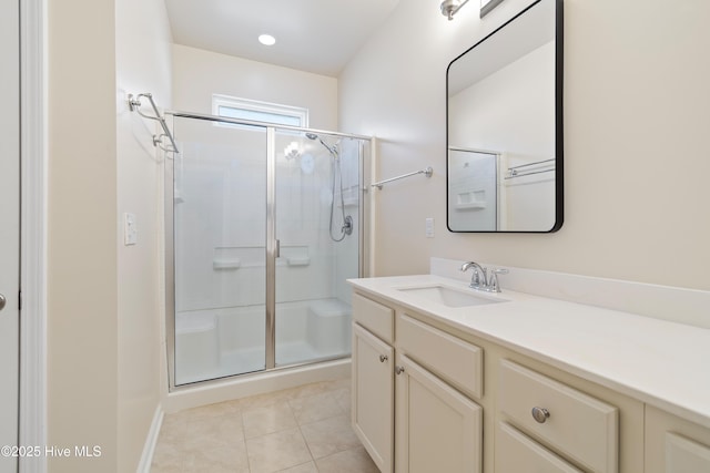 bathroom with vanity, tile patterned flooring, and a shower with door