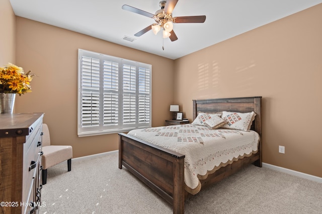 bedroom with light carpet and ceiling fan