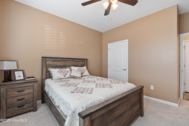 bedroom featuring light carpet and ceiling fan