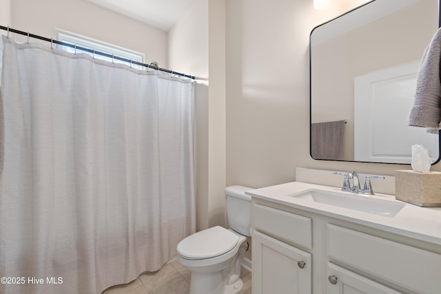 bathroom with walk in shower, vanity, tile patterned floors, and toilet