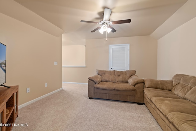 carpeted living room featuring ceiling fan and lofted ceiling