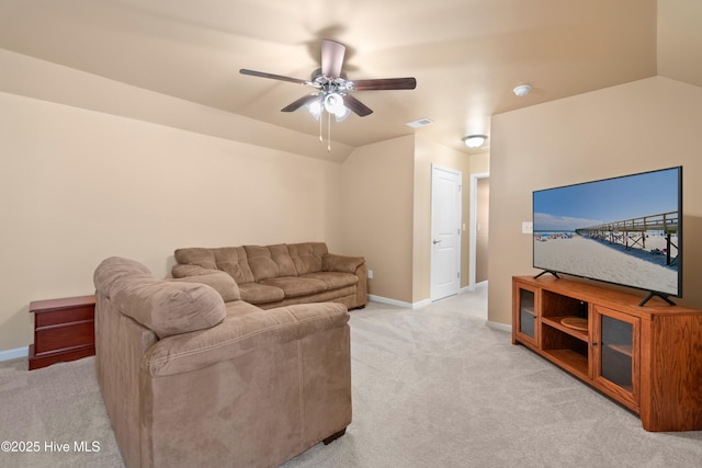 carpeted living room featuring ceiling fan and lofted ceiling