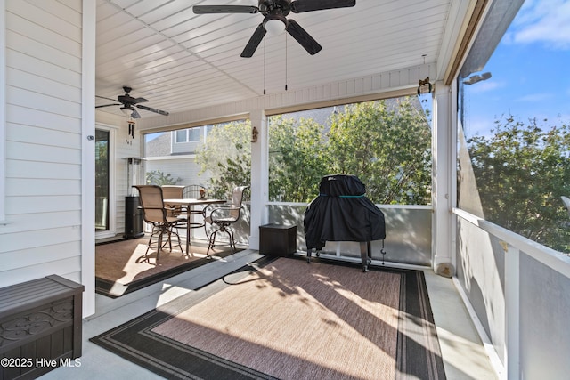 view of patio featuring ceiling fan