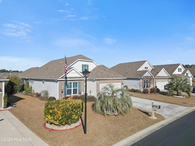 view of front of home with a garage and a front yard