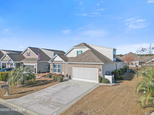 view of front of property featuring a front lawn and a garage