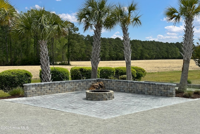 view of patio / terrace featuring a fire pit