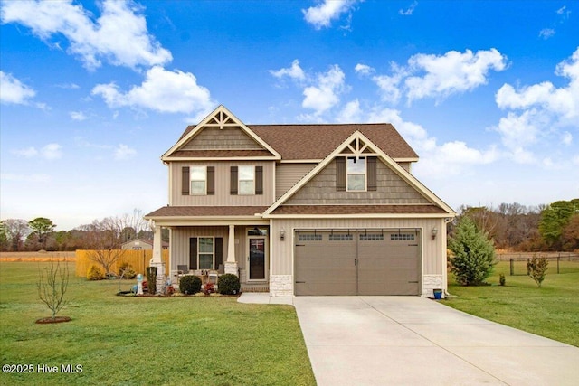 craftsman-style home featuring a front yard, a garage, and a porch