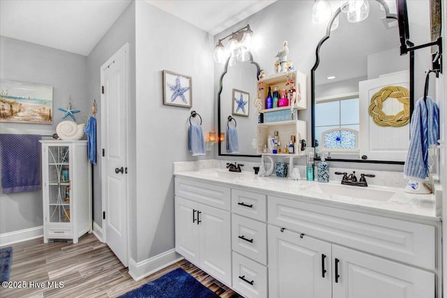 bathroom featuring hardwood / wood-style flooring and vanity