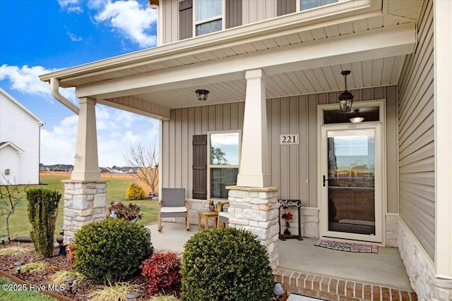 property entrance with covered porch