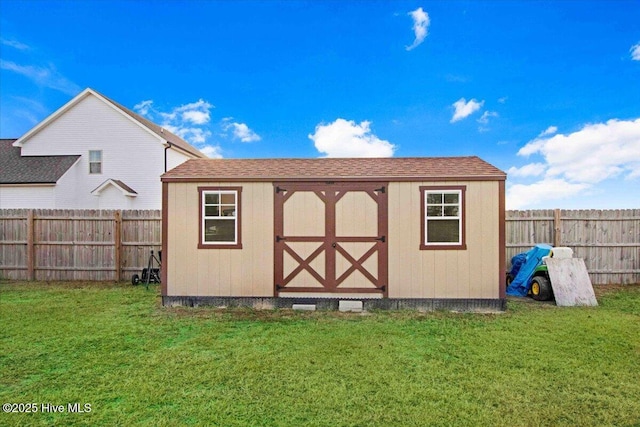 view of outbuilding with a lawn