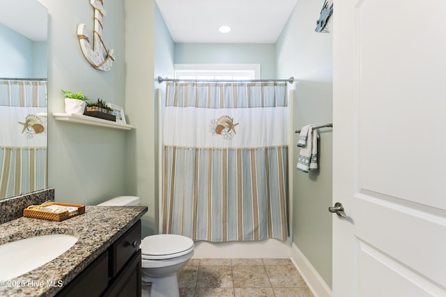 bathroom with toilet and vanity