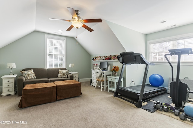 exercise room with ceiling fan, carpet, and plenty of natural light