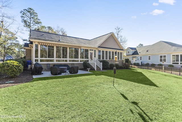 back of house featuring a yard and a patio