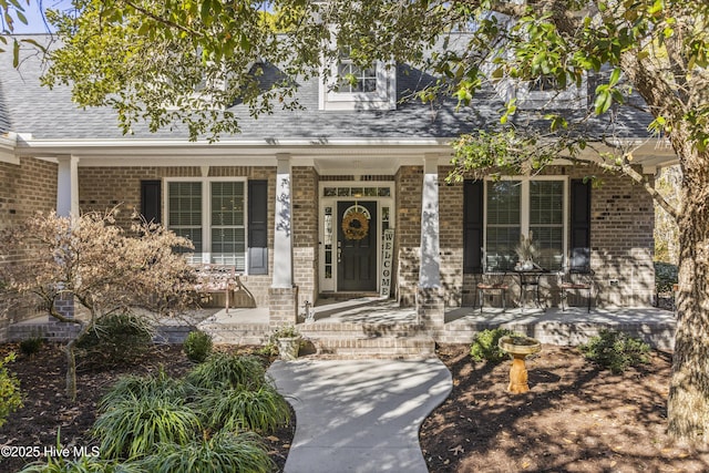 entrance to property with a porch