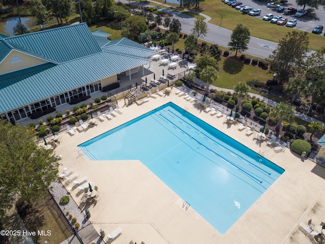 view of swimming pool with a patio