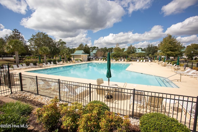 view of swimming pool with a patio area