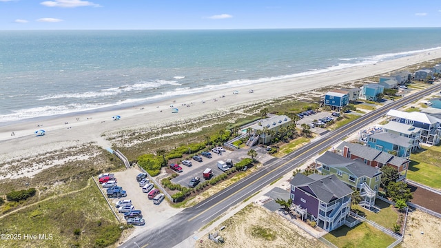 bird's eye view featuring a beach view and a water view