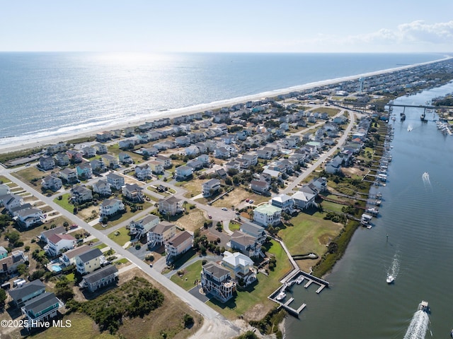 bird's eye view featuring a water view and a view of the beach