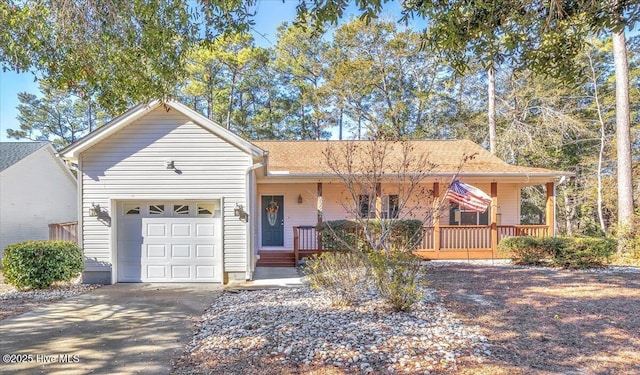 ranch-style house featuring a garage and covered porch