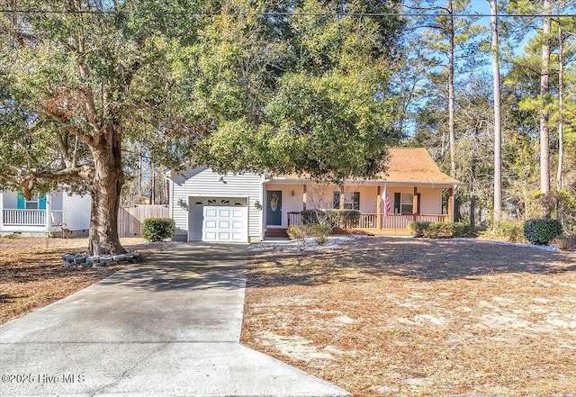 view of front of property with a porch and a garage