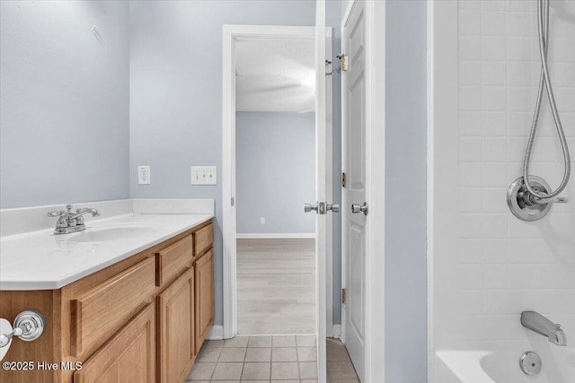 bathroom with shower / bathing tub combination, vanity, and tile patterned floors