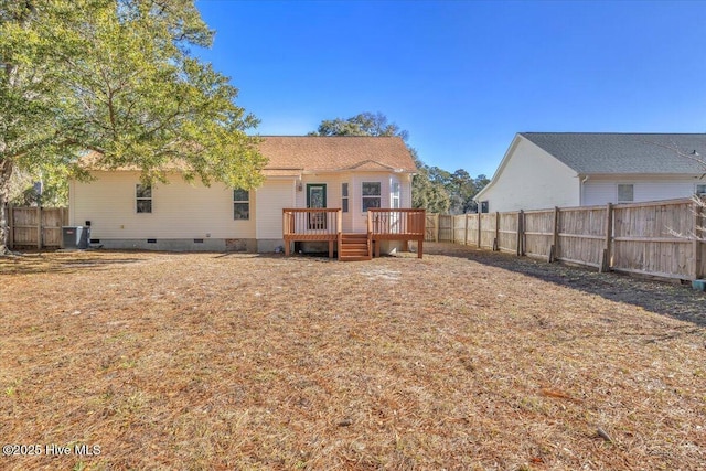 rear view of house with central AC unit and a deck