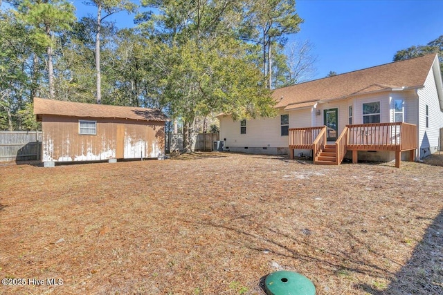 rear view of property with a deck and central air condition unit