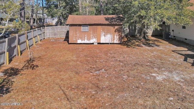 view of yard with a storage shed and central air condition unit