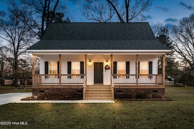 bungalow-style house featuring a porch and a front lawn