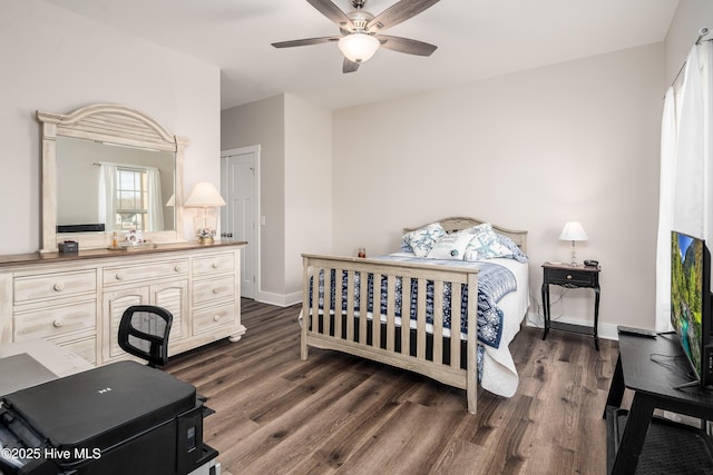 bedroom featuring ceiling fan and dark hardwood / wood-style flooring