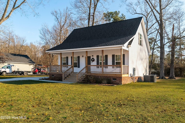 view of front of property with central AC, a porch, and a front lawn