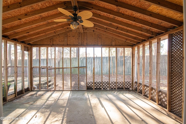 unfurnished sunroom with ceiling fan