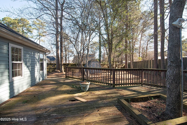 wooden deck featuring a shed