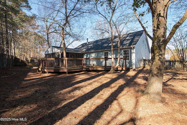 back of property featuring a deck